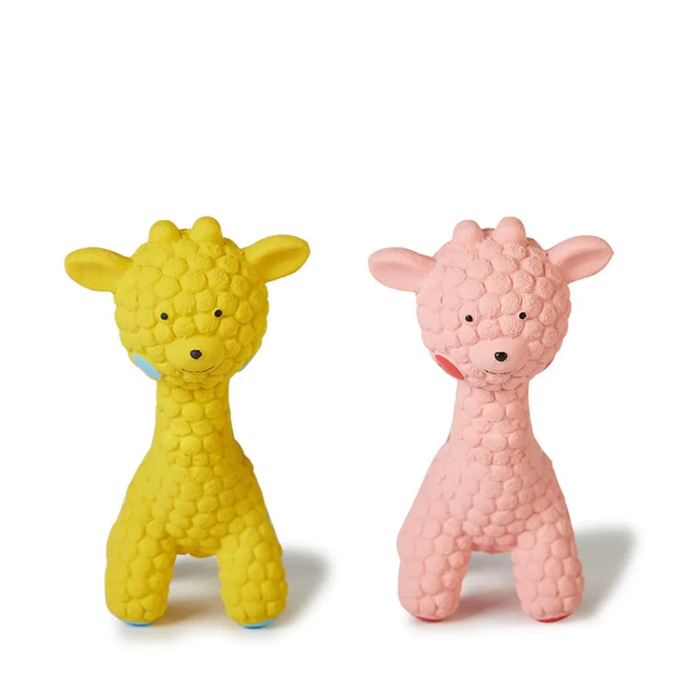 Yellow and pink giraffe-shaped dog chew toys on a white background