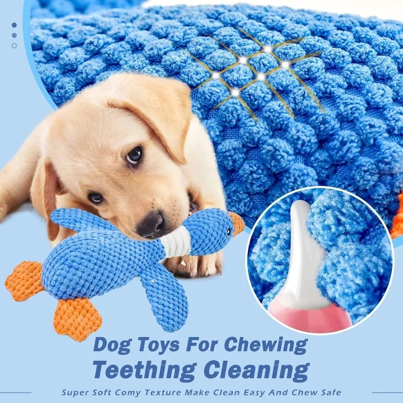 Dog playing with a blue goose toy on a textured blue mat, with an inset showing the texture of the mat.