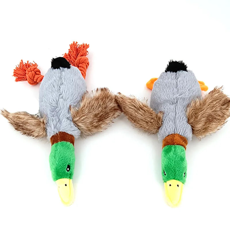Two plush duck toys: 1 with rope feet and the other with plush feet, both with fur tails on a white background